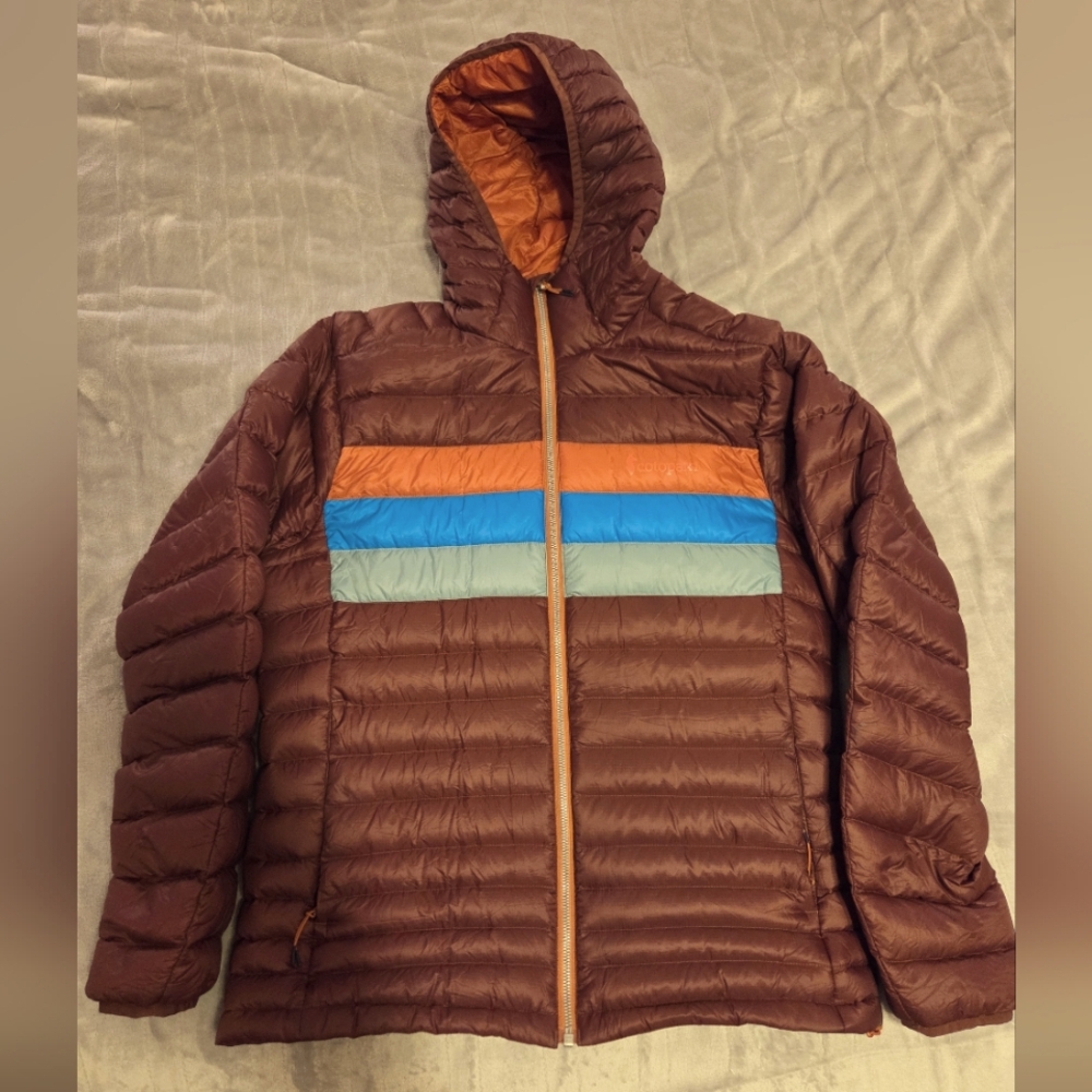 Cotopaxi Brown Puffer Jacket with Orange and Blue Accents